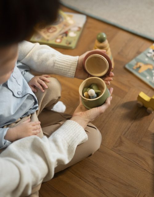 close-up-parent-kid-with-toy