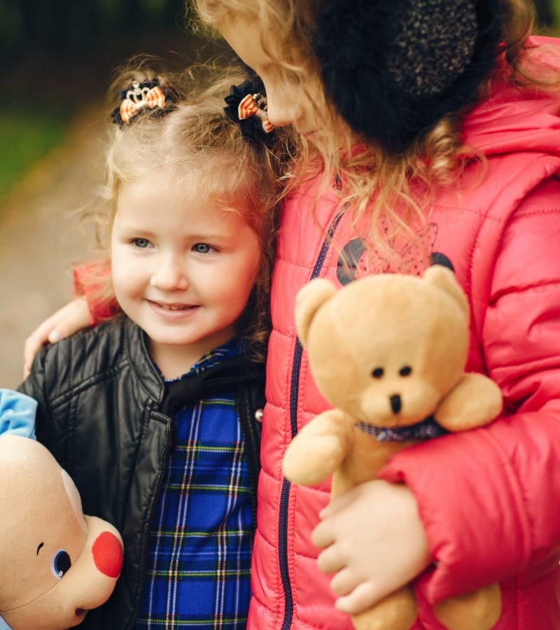 Two cute kids in a park. Children playing.